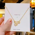 Collier épingle doré avec breloques lune et étoile pavées dans un style minimaliste - Étoile Lune Trombone