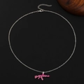 Detailed view of a pink AK-47 rifle pendant with rhinestones on a silver chain - Silver Chain Pink AK-47 Full Rhinestone (DZ-420)