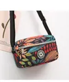 Waterproof nylon crossbody bag featuring colorful tropical leaf patterns and adjustable strap - Colorful Leaves