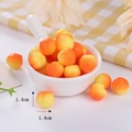 Detailed macro view of 1.4cm miniature TPR peach toys with gradient color finish - Nectarine