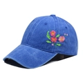Detailed view of floral embroidery on blue washed cotton baseball cap with curved brim - Adjustable / Sapphire Blue