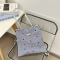 Detail of blue and white checkered canvas tote bag with floral pattern on a chair - Blue Grid Dark Blue Flower