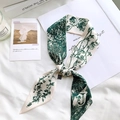 Close-up of floral silk scarf with letter J print on elegant white fabric background - Sketch Spring Letter J