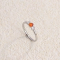 Retro titanium steel ring featuring a vibrant orange gemstone and sparkling side stones - Steel White + Red Diamond