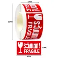 Macro detail of 45x25mm red fragile warning labels on roll with white icons - C106 (Red with Thai)
