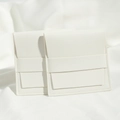 White faux leather jewelry pouch with snap button and litchi texture finish - 8*8cm / White