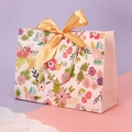 Pink floral gift paper bag with a gold ribbon bow and golden twisted rope handles - XS (19x15x7cm) / Spring Romantic Pink (Floral)