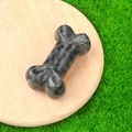 35mm bone-shaped dark polished natural stone ornament with unique speckled texture - Larvikite