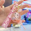 Pink tiger liquid quicksand keychain featuring a lollipop charm and silicone wrist strap - Lollipop with Leather Rope