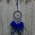 Handmade dreamcatcher with blue feathers and natural stones hanging on a bead curtain - Lapis Lazuli Full Color