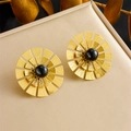 Golden flower earrings with a black gemstone center in a sunburst metal design - E6167