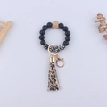 Portachiavi da polso in silicone con perline leopardate e nappa nera coordinata - Stampa leopardata