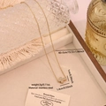 Delicate gold stainless steel cross necklace with cubic zirconia and 40cm extension chain - Cross (N1697-1)