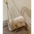 Quilted beige crossbody bag with gold chain strap and elegant metallic twist lock - White