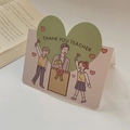Cartoon folding teacher appreciation card featuring a large green heart with thank you text - Teacher's Day Green