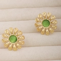 Close-up of golden daisy stud earrings with green opal center on beige velvet - Sunflower Cat's Eye Studs