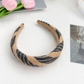 Classic woven headband featuring a chic black and beige geometric pattern design - Brown