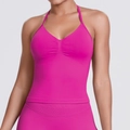 Close-up of seamless halter neck sports bra with ribbed center in hot pink stretch fabric - Dragon Fruit