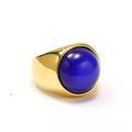Detail of a thick gold plated ring featuring a large polished deep blue gemstone cabochon - US 11 / Gold Dark Blue Cat Eye Stone