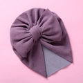 Detail of soft purple newborn turban hat featuring a large double layered bow knot - Deep purple