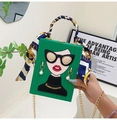 Dettaglio della borsa da sera graffiti verde con viso cartoon e manico in seta - Verde