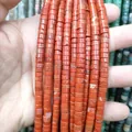 Macro detail of natural red agate cylinder beads for jewelry making and DIY projects - Red Jasper