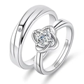 Close-up of silver couples rings featuring a flower design and solitaire crystal setting - Sweet Four-Leaf Clover