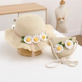 Detail view of beige woven straw hat and matching crossbody bag with white daisy flowers - Hat and Bag Set / Beige