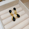 Close-up of vintage gold teardrop earrings with black resin stones in velvet box - Silver Pin - Black Waterdrop Cross Dangle Earrings