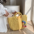 Bright yellow bohemian straw handbag with colorful pompom tassels and drawstring closure - Yellow