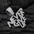 Macro shot of silver hip hop pendant with NEVER GIVE UP engraving and shining crystals - Never Give Up Pendant / Silver