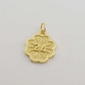 Close-up of gold flower pendant with 24 engraving and micro-pave cubic zirconia details - Number 24 Flower