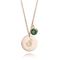 Detail of rose gold birth flower pendant and dark green gemstone on stainless steel chain - May Lily of the Valley