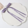 Elegant purple satin ribbon bow hair clip displayed on a white petal plate accessory - Duckbill Clip-Z206 / Deep purple