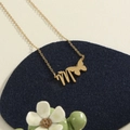 Golden stainless steel necklace featuring a butterfly and letter M pendant design - Gold M