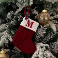 Red knit Christmas stocking featuring embroidered letter M and cable knit texture - Style M