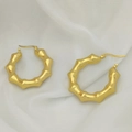 Detailed view of golden bamboo-style hoop earrings on elegant white silk background - Bamboo Design Style (XL1464-64)