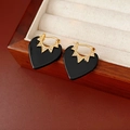 Macro detail of gold-plated black heart earrings with sparkling zircon star motifs - Ear Buckle-Gold-Black (Real Gold Plated)
