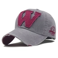 Detailed embroidery of letter W and Mild Joker logo on distressed grey baseball cap - Light Gray