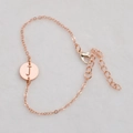 Rose gold O-chain bracelet with circular hollow pendant featuring the letter J - Rose Gold J