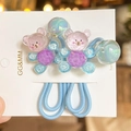 Details von blauen elastischen Haargummis mit bunten Bärenfiguren und Perlen-Dekor - 2-Teiliges Set / Himmelblau