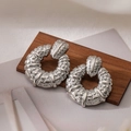 Silver-plated hoop earrings with embossed hammer texture on a wooden background - Silver (44976)