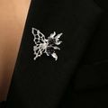 Silver butterfly brooch with black roses in gothic style on a black suit lapel - Butterfly with Black Rose Style