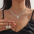 Macro shot of sparkling multi-row gold rhinestone necklace set with teardrop crystals - Gold