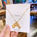 Collier élégant en titane doré avec pendentif perle cacahuète serti de zircones - Arachide perlée ouvrante dorée