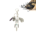 Bohemian dreamcatcher keychain with purple crystal and Hamsa hand on white background - Purple