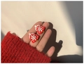 Close-up of red Christmas bell earrings with white snowflakes held in hand - Christmas Bell (S925 Silver Pin)
