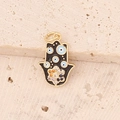 Detailed close-up of a Hamsa hand pendant with blue evil eye patterns on a stone base - Black