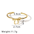 Detailed top view of 18K gold bow knot bangle with sparkling zircon stone inlay - Gold Bowknot Open Bracelet (NB-B6207)