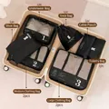 9-piece black travel organizer set with numbered packing cubes inside a suitcase - Black 9-Piece Set